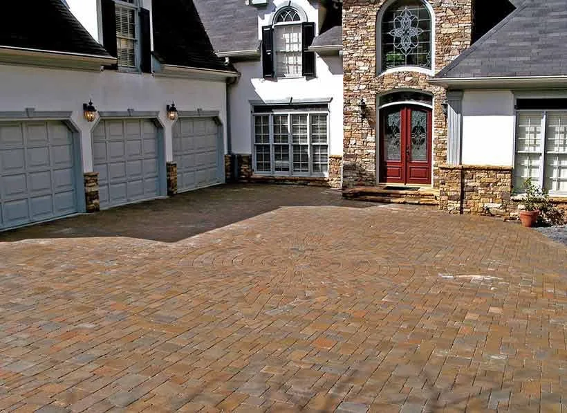 house with paver driveway