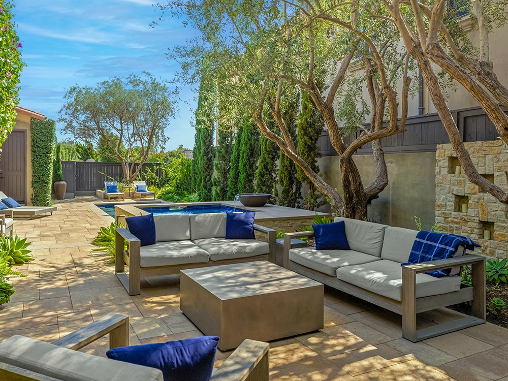 Paving stone patio with stone wall. 