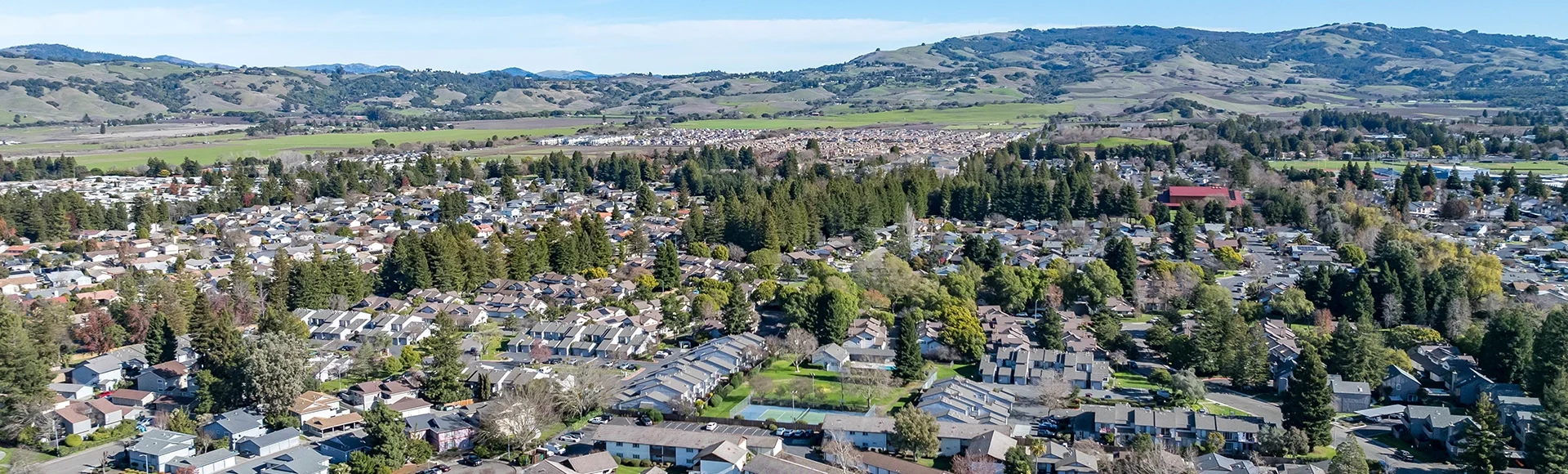 Aerial images over a community in Rohnert Park, California on a beautiful winter day with a blue sky