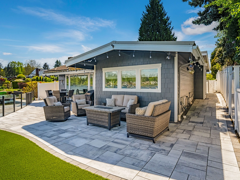Large paver patio next to artificial grass in Seattle. 