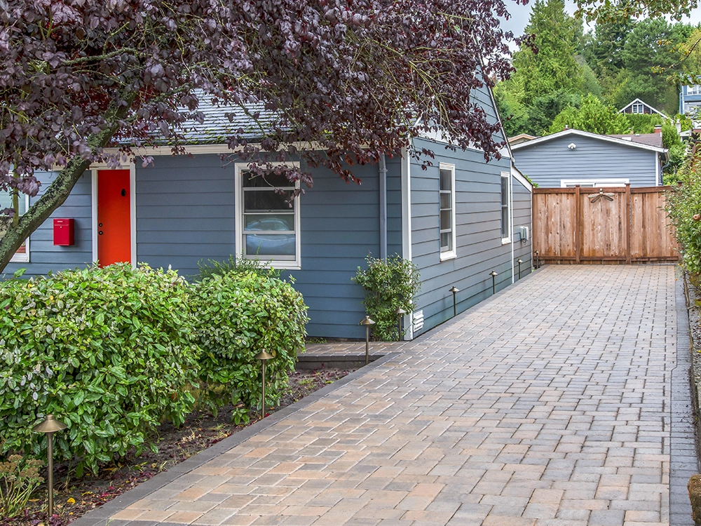 Paver driveway transforms a small home in Washington. 