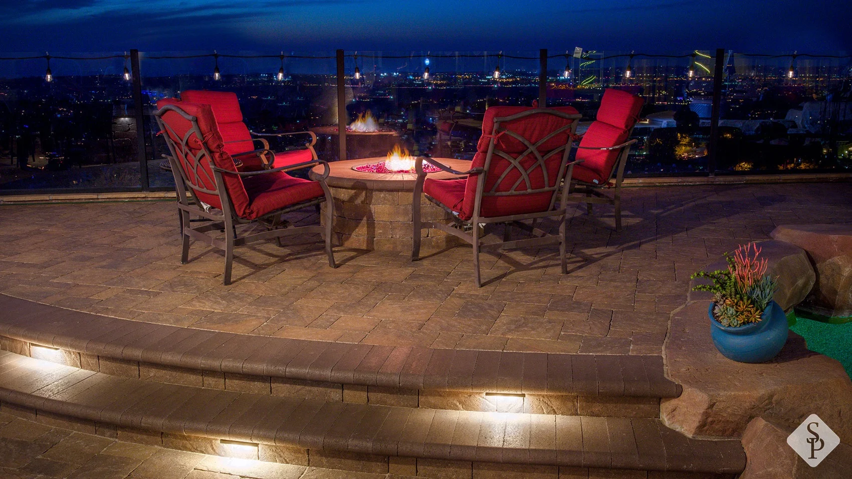 paver patio, firepit at night