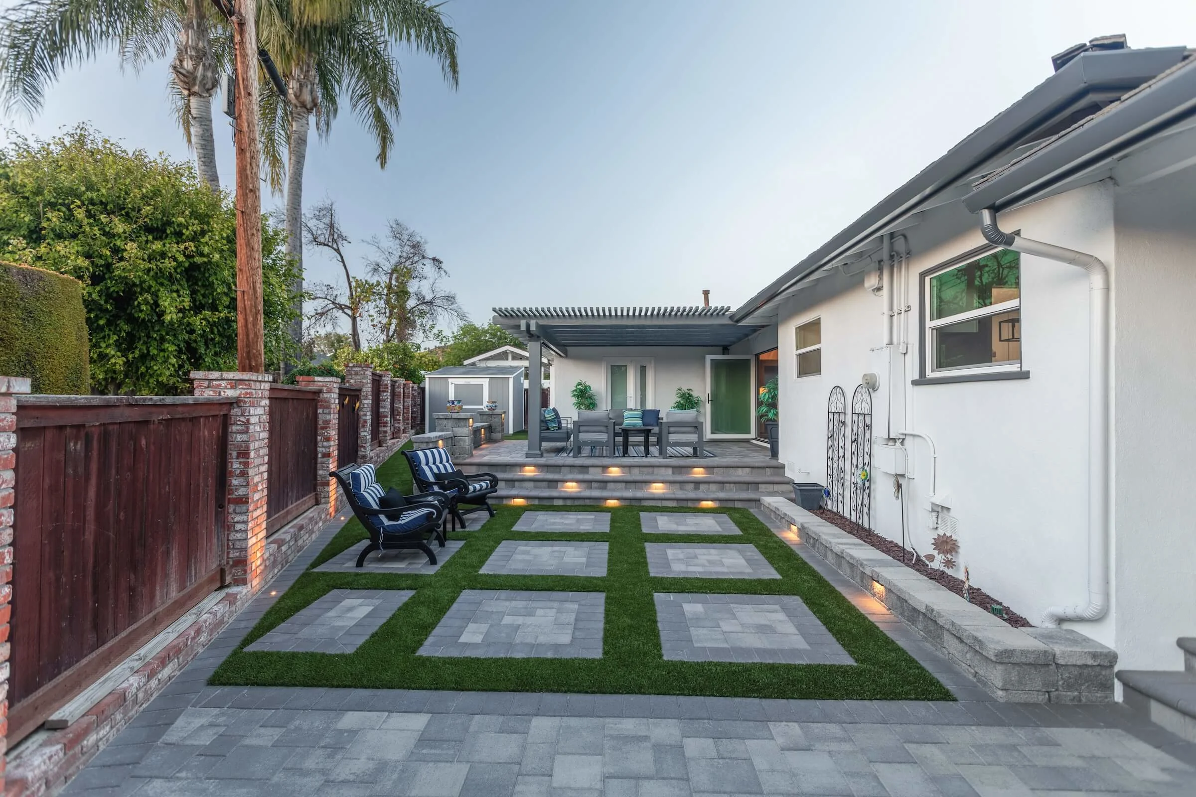Stunning Southern California backyard with pavers, turf, and a pergola