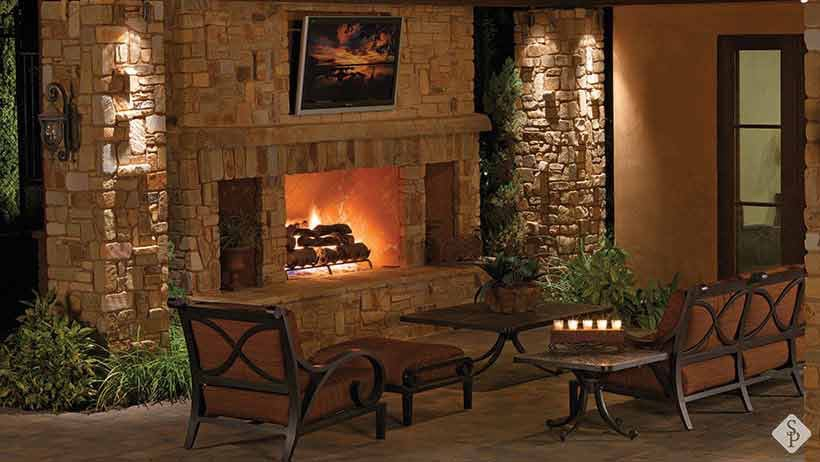 patio with outdoor fireplace