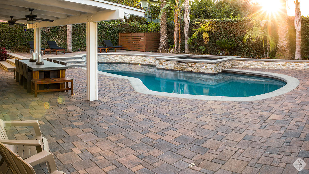 pool deck pavers in a backyard