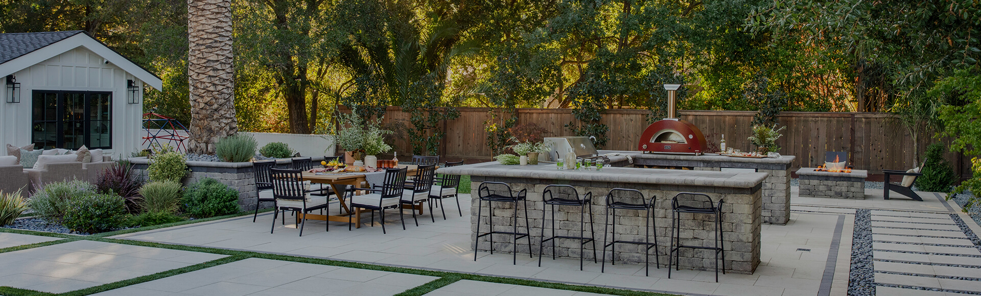 Backyard with pavers and outdoor kitchen