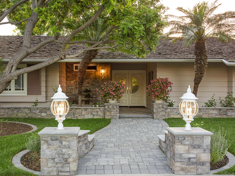 Paving stone walkway with lovely stone yard borders and stone walks with built-in lights. 