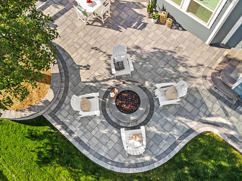 Backyard paving stone patio in a large yard in Colorado. 