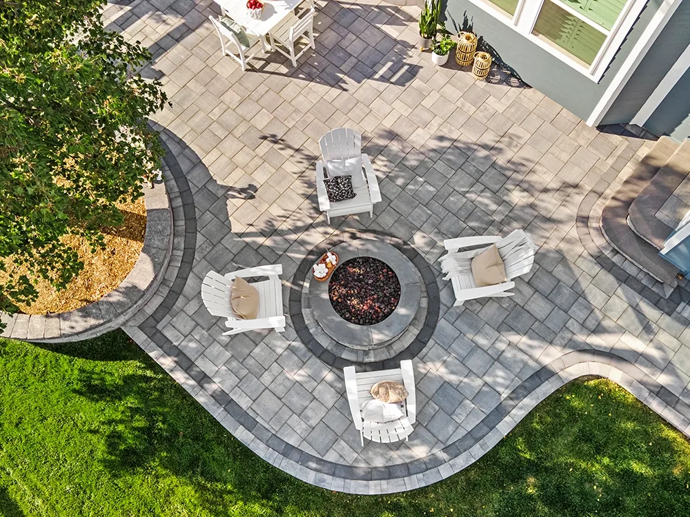 Backyard paving stone patio in a large yard in Colorado. 