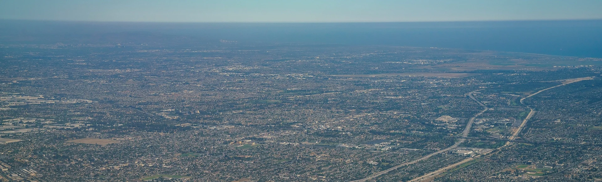 Aerial view of Santa Fe Springs, Norwalkm Bellflower, Downey, view from window seat in an airplane