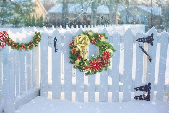 snowy fence with wreath