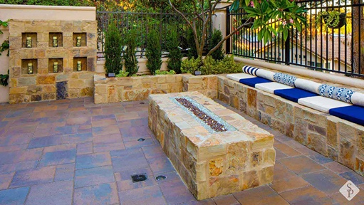 paver patio with stone fire pit