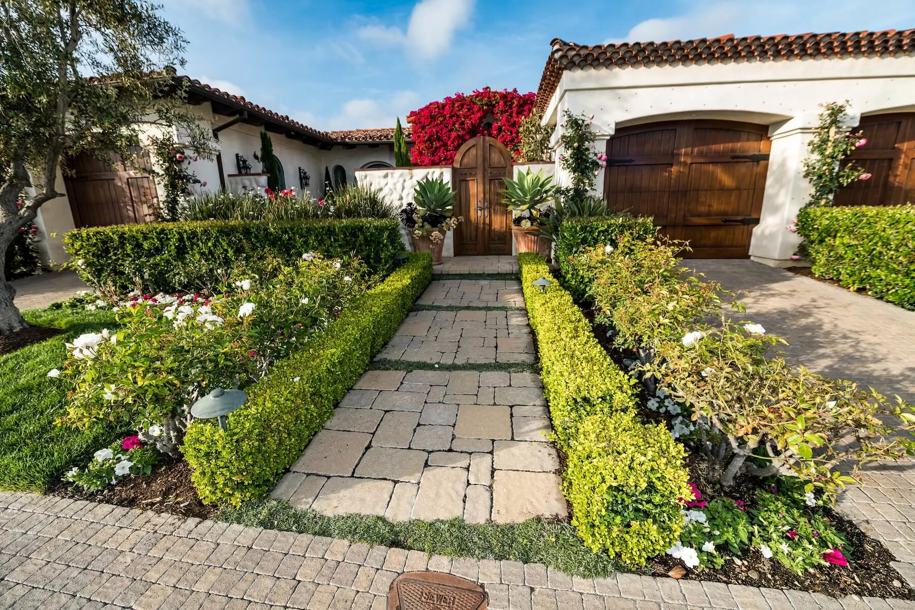 Paving stone walkway and front entrance and paver driveway curb appeal