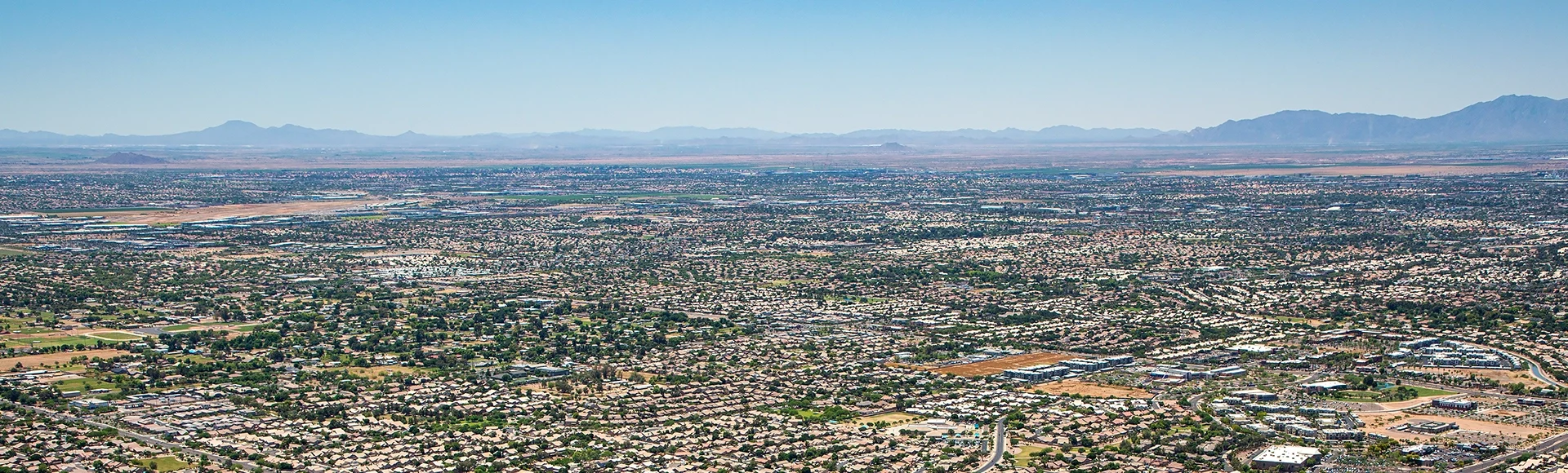 Over Gilbert, Arizona rooftops near Warner Road & Lindsay Road looking SW towards Chandler.Arizona