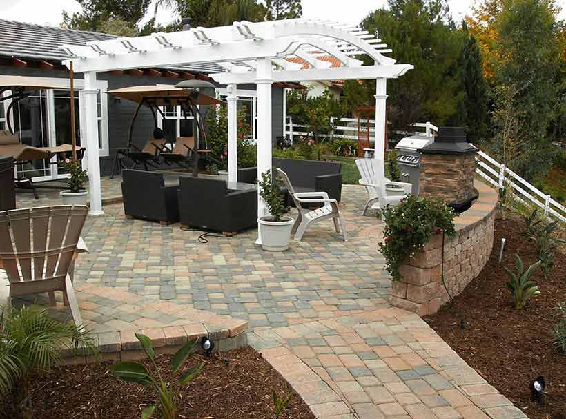 paver patio, retaining wall, and pergola