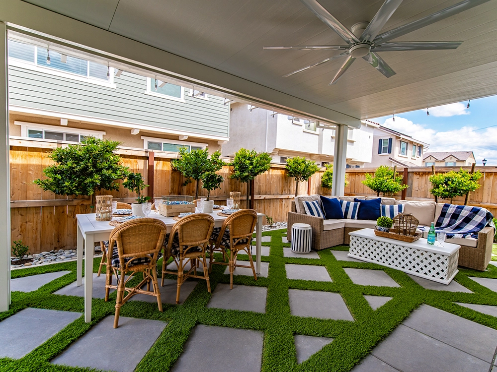 Small yard transformed into an oasis with adding pavers, turf and pergola. 