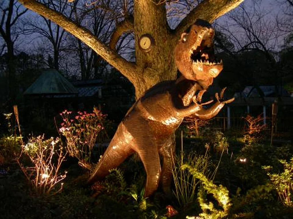 T-rex lit up from below with outdoor LED lighting 