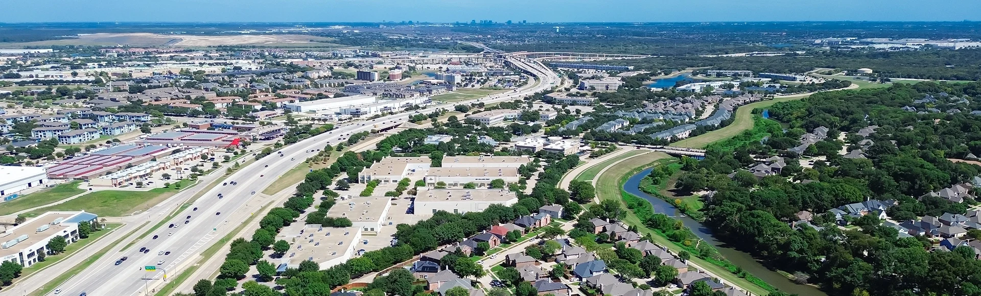 Fast growing mixed-use development area along Sam Rayburn Tollway, East Highway 121 in Lewisville – Coppell Texas, commercial buildings, warehouse, residential houses, downtown Dallas background