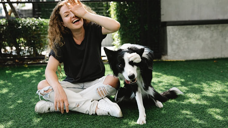 Dog and owner on artificial turf