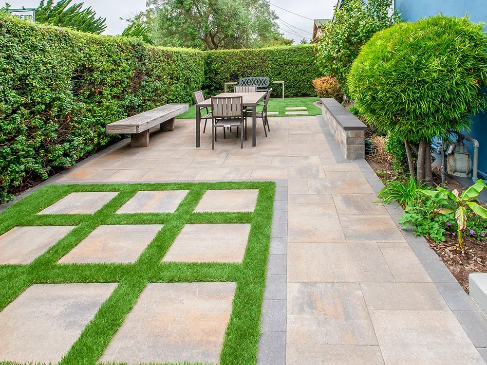 Paving stone patio backyard with outdoor seating