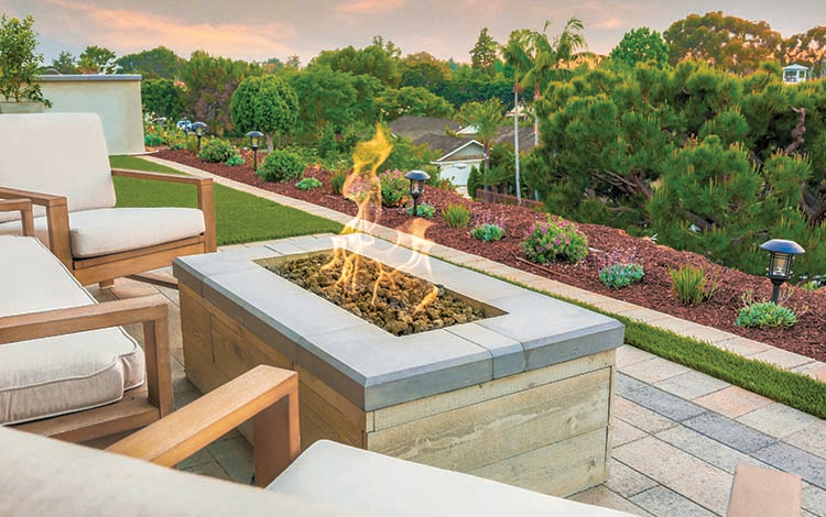 Fire pit, gas fire pit, lit, rectangular fire pit, pavers, artificial turf, artificial grass, patio furniture, view, paving stones, California, daytime, evening