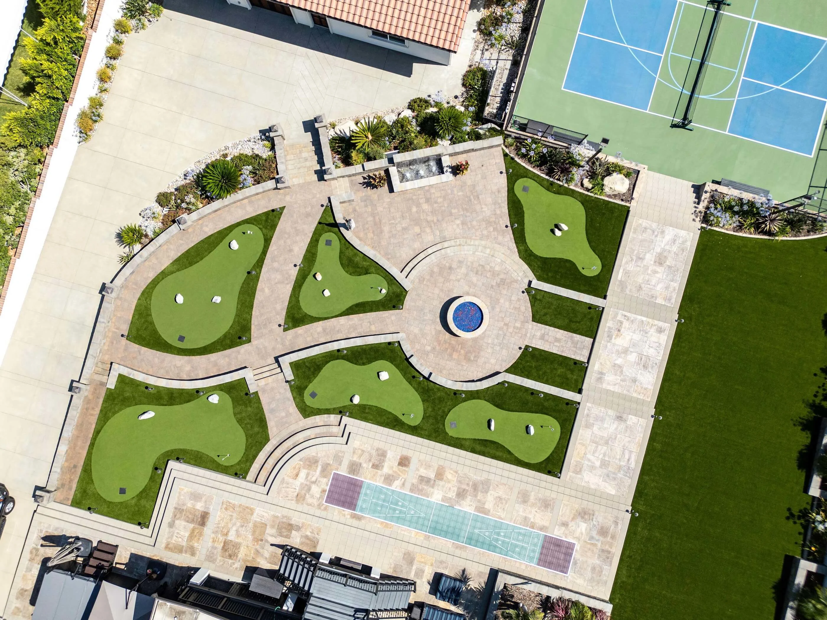 Arial view of outdoor pavers and turf backyard transformation