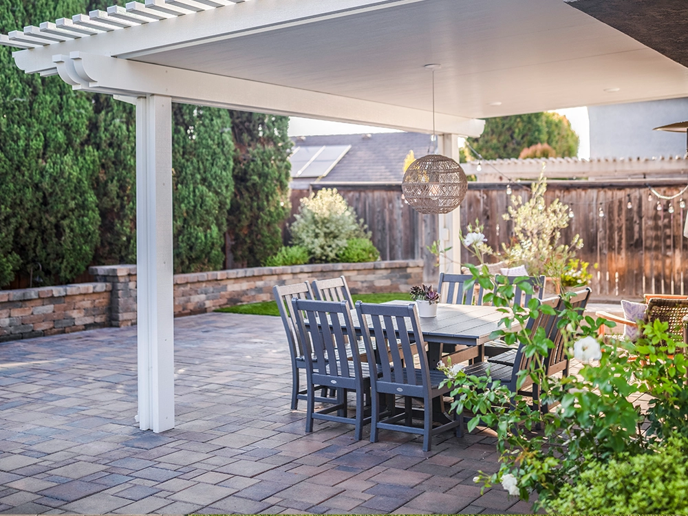 Backyard paver patio with a pergola. 