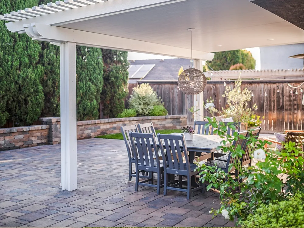 Backyard paver patio with a pergola. 