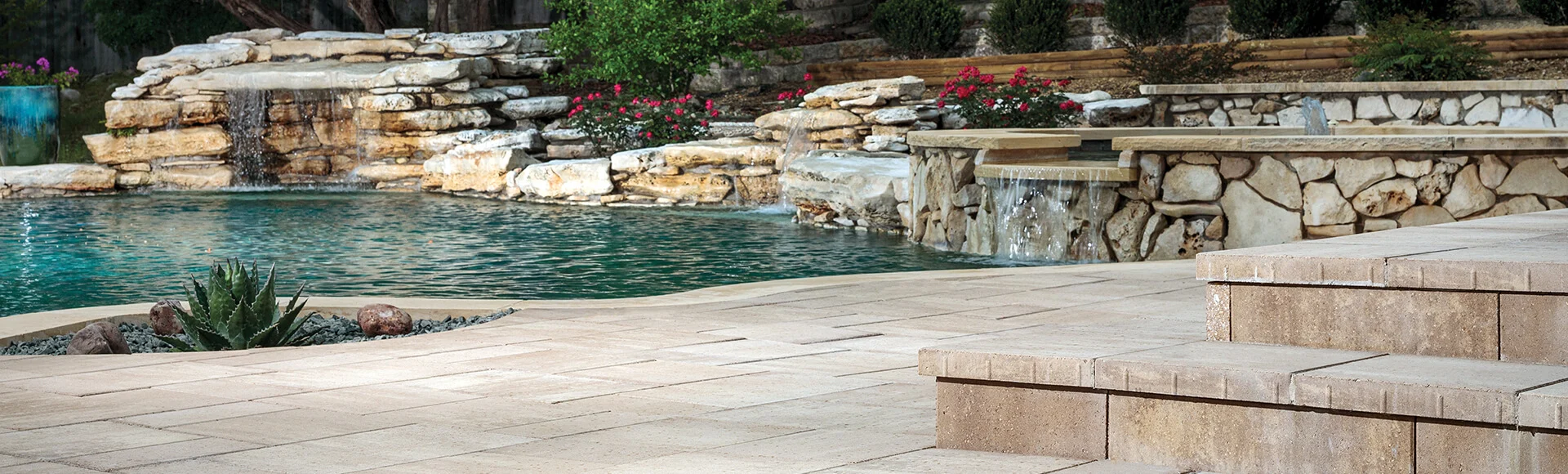 Paver pool deck, pool, water, hot tub, waterfalls, water feature, awning, patio furniture, backyard, paving stones, universal region, daytime