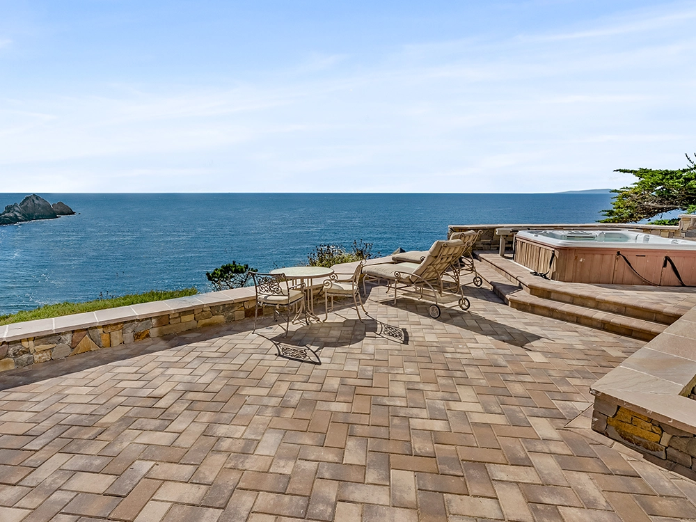 Paving stone patio that overlooks the ocean. 