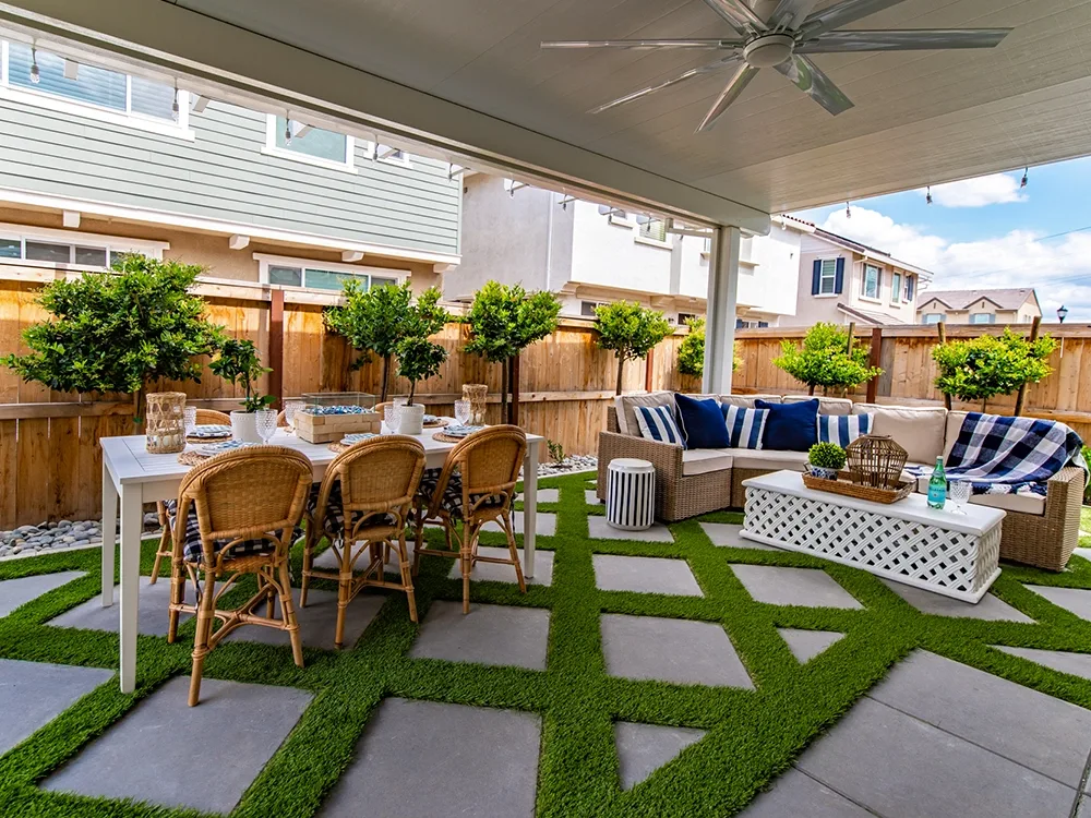 Back patio with pergola transforms a small backyard. 