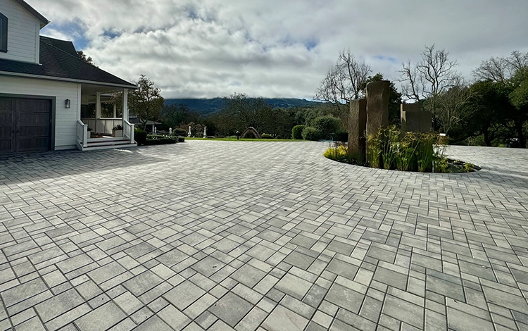 Large home in Texas with paving stone driveway