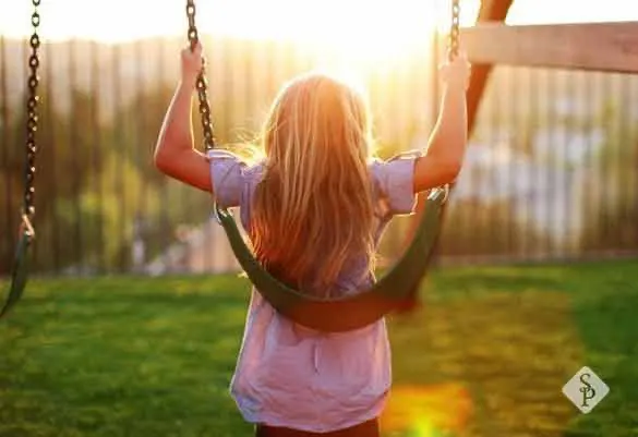 kid on swing