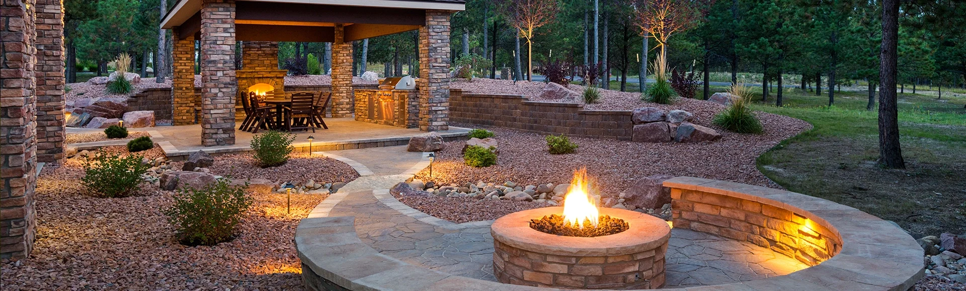 Large paver patio with fire pit, fire place and pergola. 