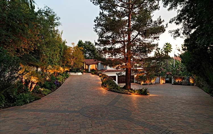 Outdoor lighting, paver driveway, split driveway, driveway design, curb appeal, pavers, California, evening