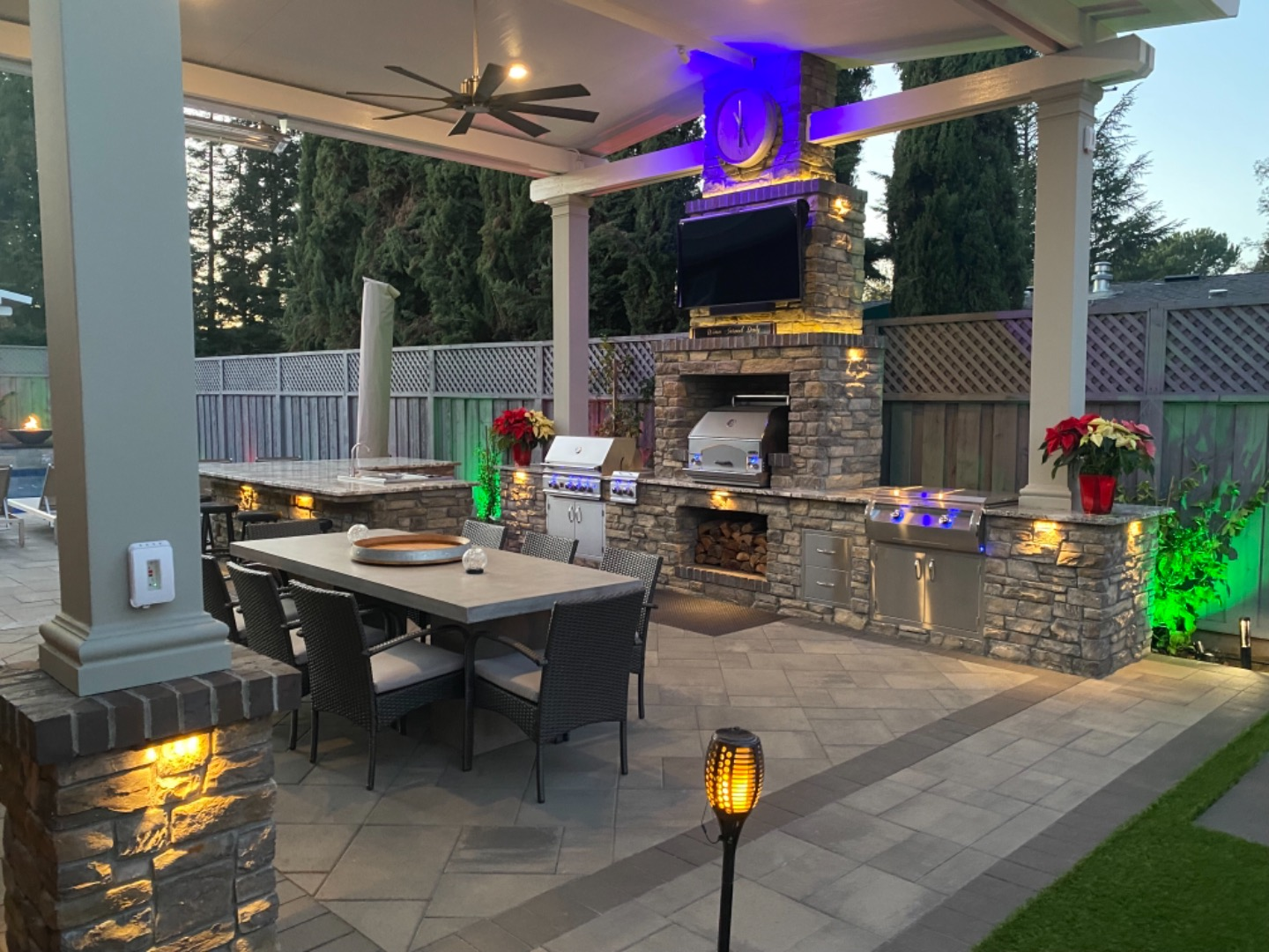 Bold Colors Outdoor Kitchen Grill Paver Pergola Lights Countertops Dining Area