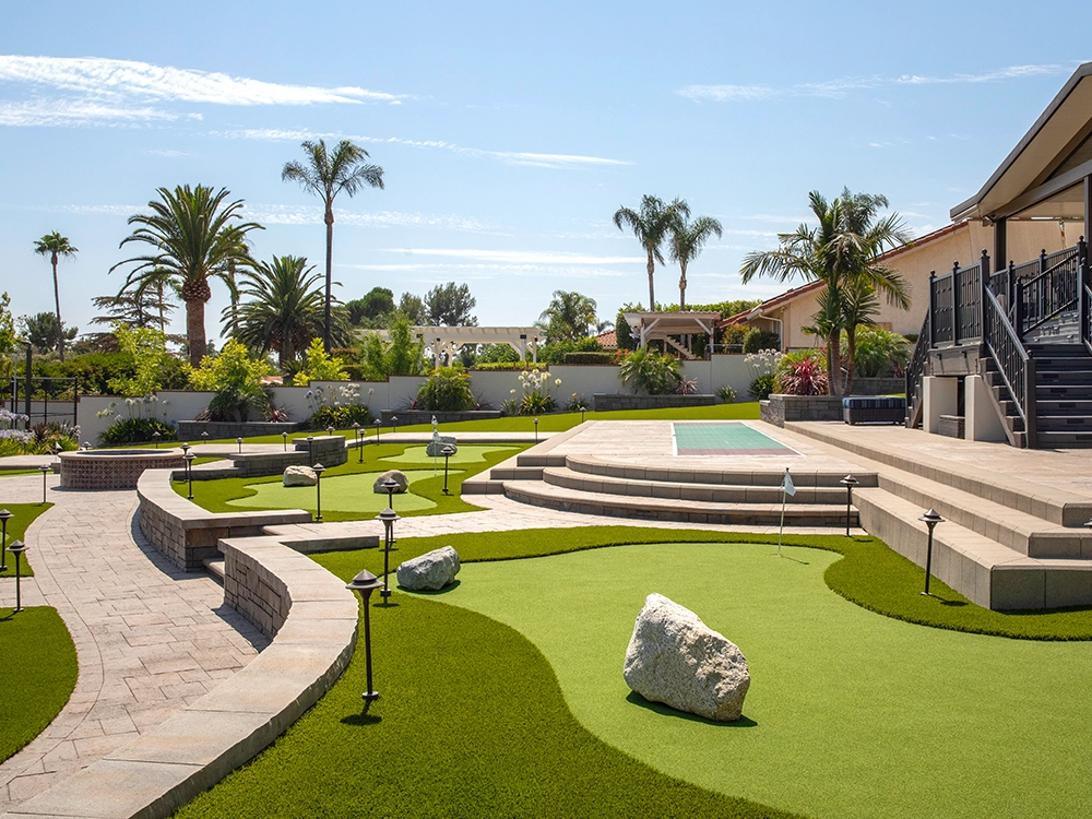 Backyard putt putt course built by System Pavers. 