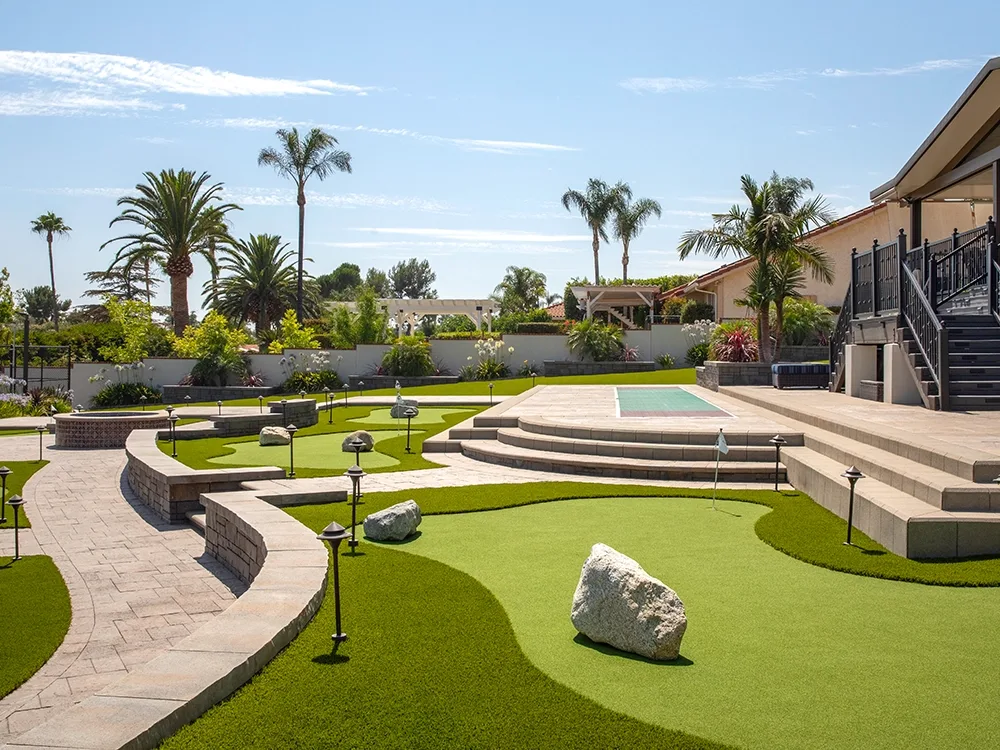 Backyard putt putt course built by System Pavers.