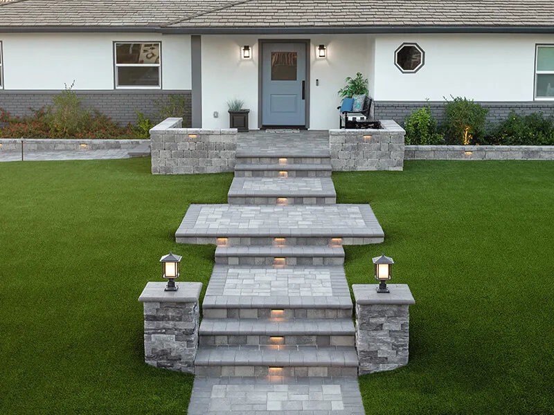 Gay paver steps and walkway with lighting. 
