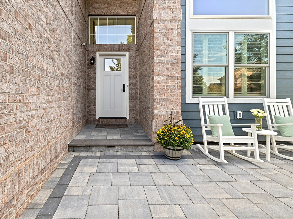Front paving stone patio with paving stone stairs. 