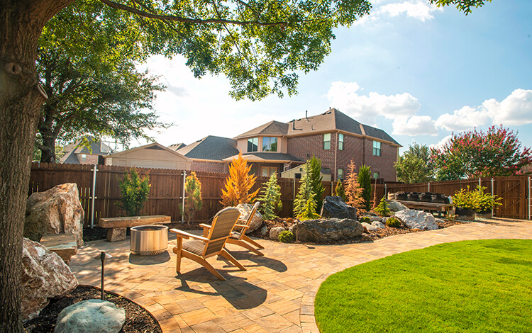Landscaped Texas backyard with paver patio