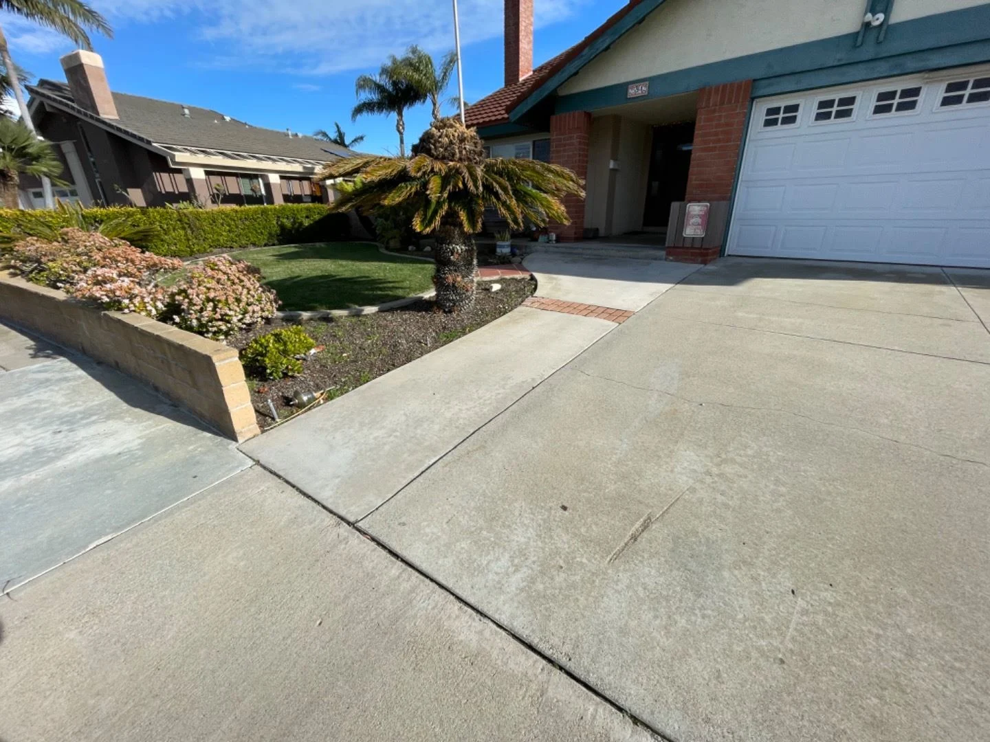 Concrete driveway and walkway before upgrading to pavers