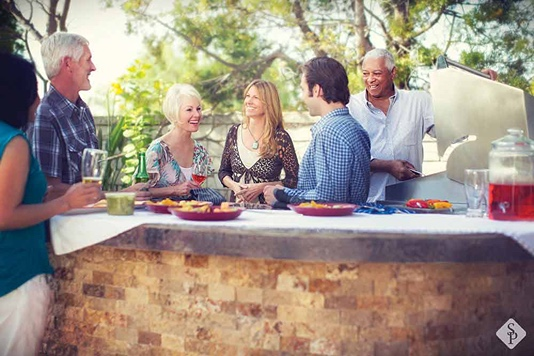 people at a bbq grill