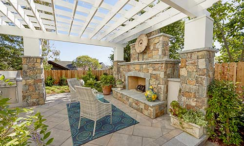 Pergola, outdoor fireplace, paver patio, outdoor kitchen, pillars, patio furniture, rectangular awning, patio cover, backyard ideas, universal region, daytime