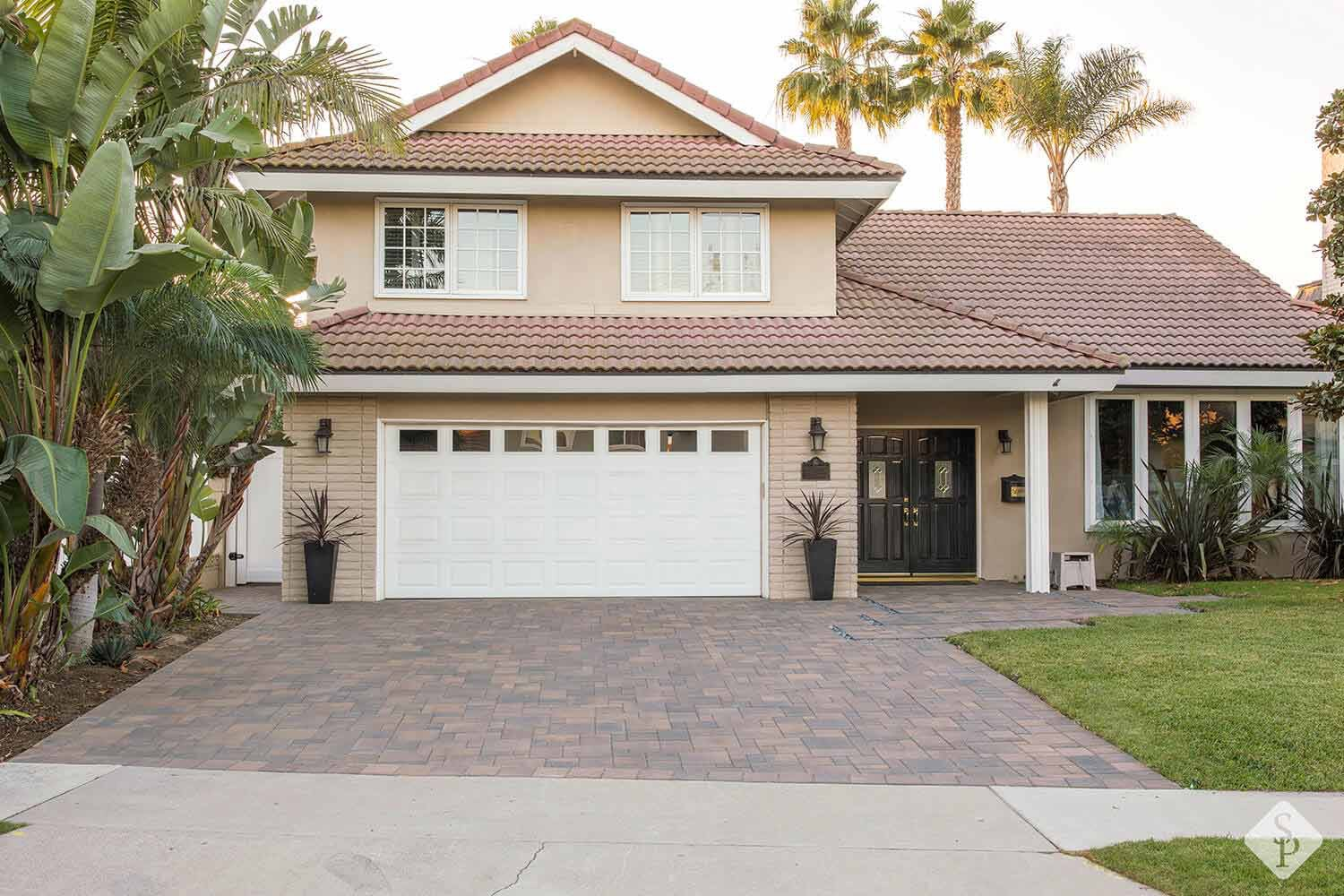 house with paver driveway