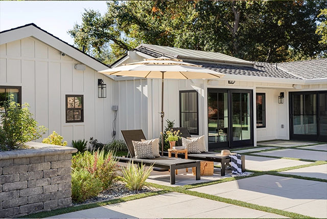 Backyard Patio with umbrella and chairs. 