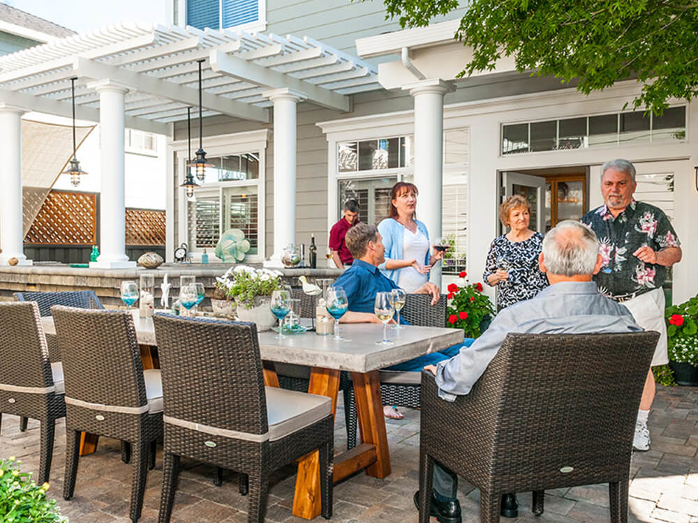 Family on a paving stone patio with pergola