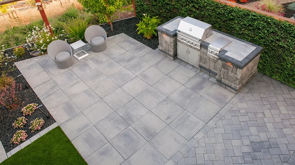 Overhead shot of a paver deck with built-in grill station