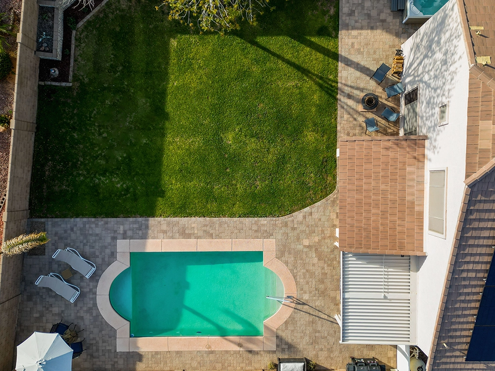 Backyard paver pool deck in Arizona. 