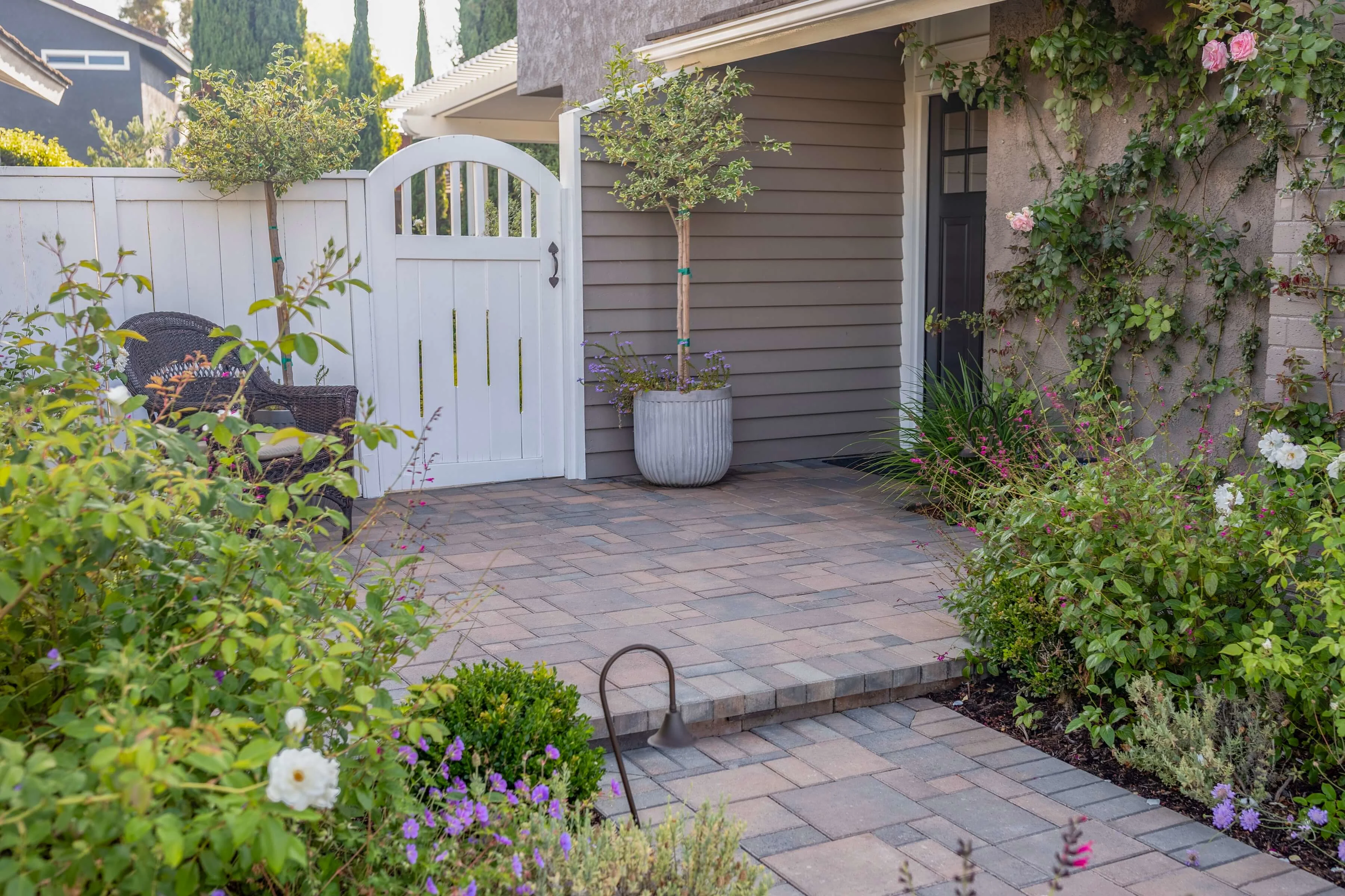 Gated side yard with spacious paver patio entrance
